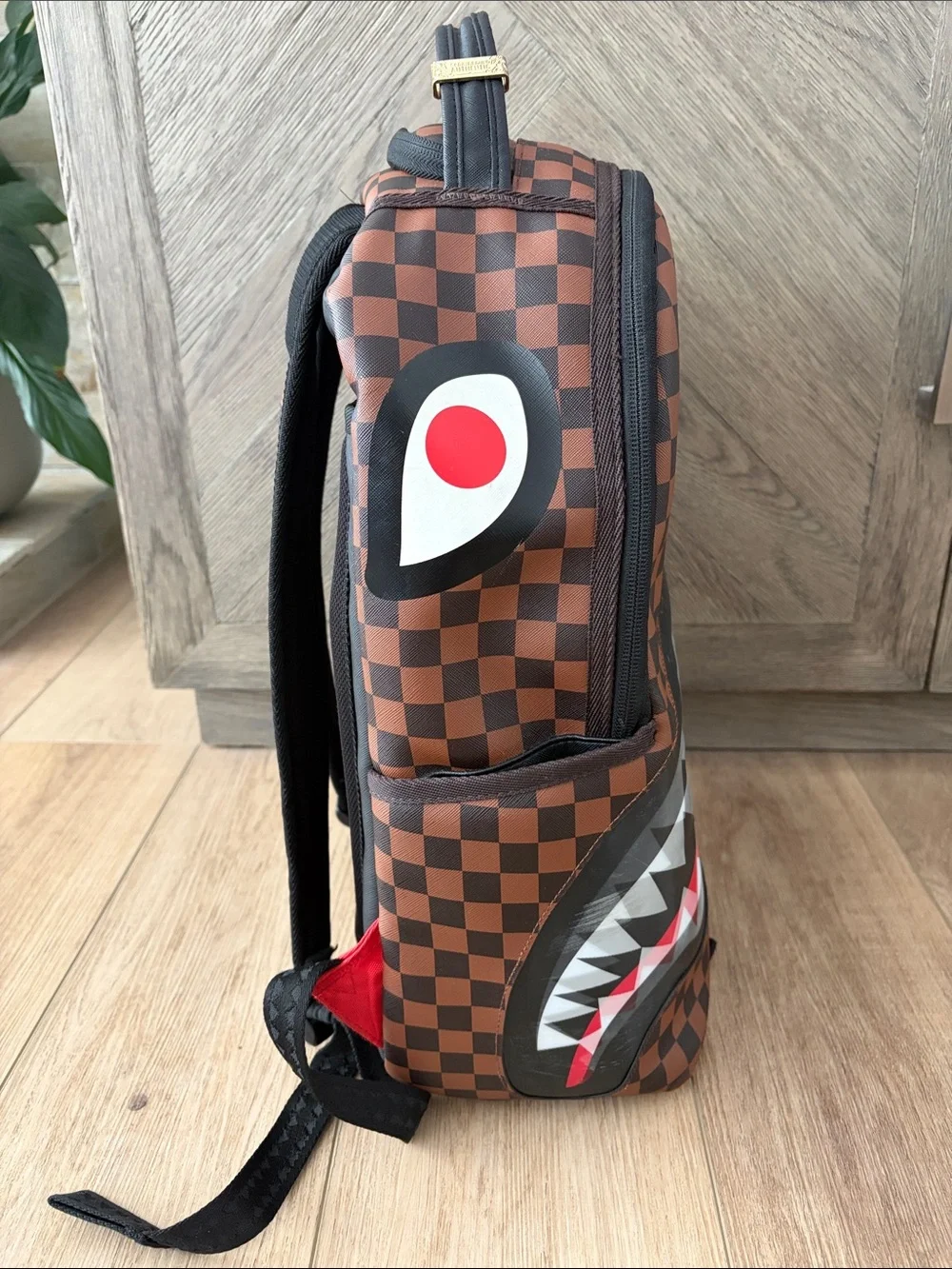 Sprayground Brown Checkerboard Backpack with Red & White Shark Mouth